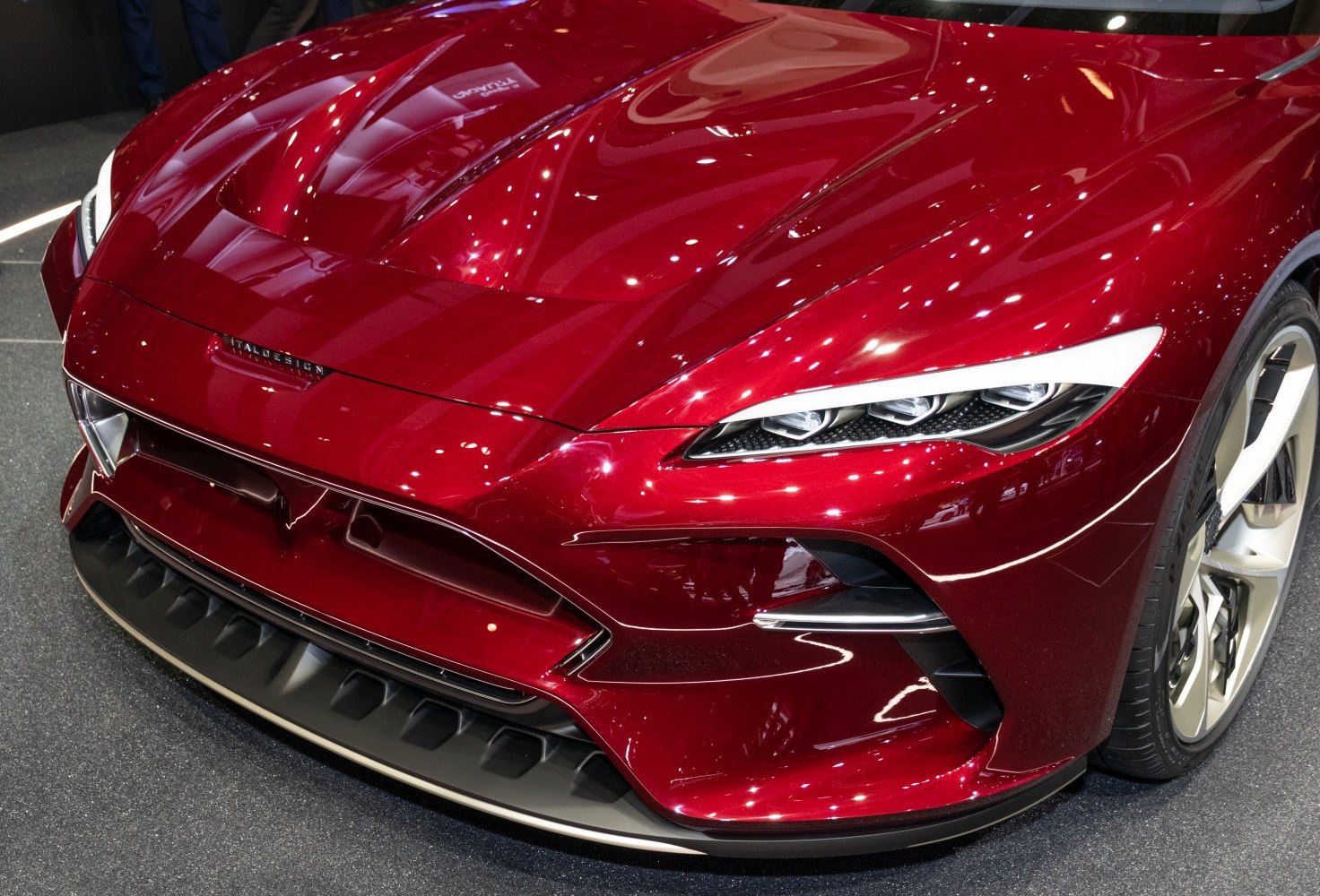 Sleek front fascia with aggressive headlights and aerodynamic detailing