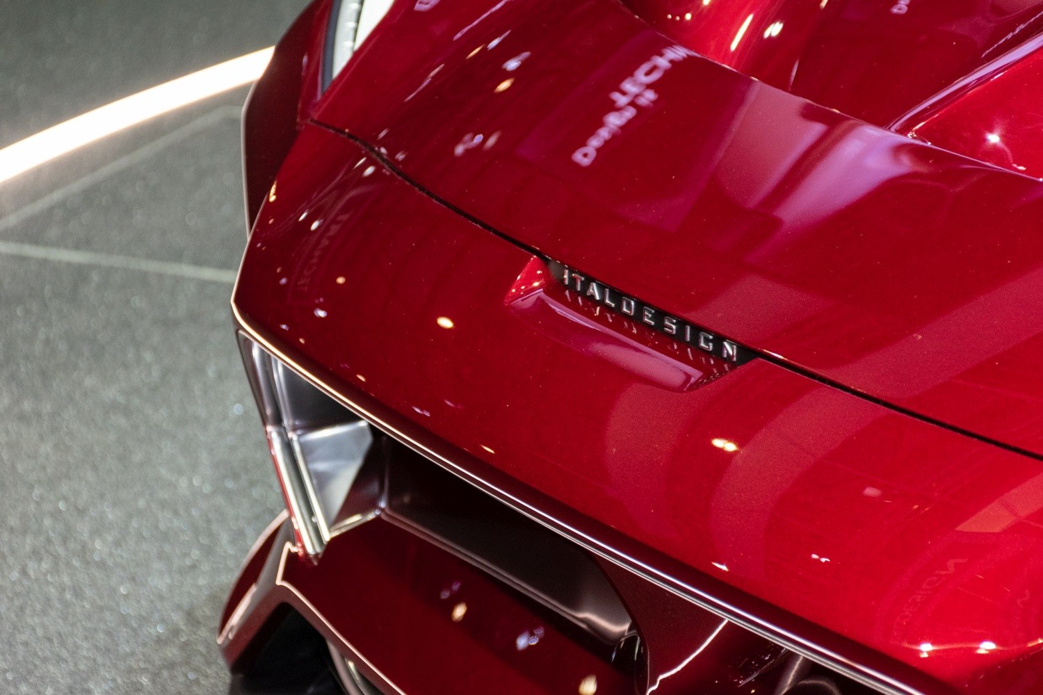 Close-up of front with Italdesign badge and sharp aerodynamic lines