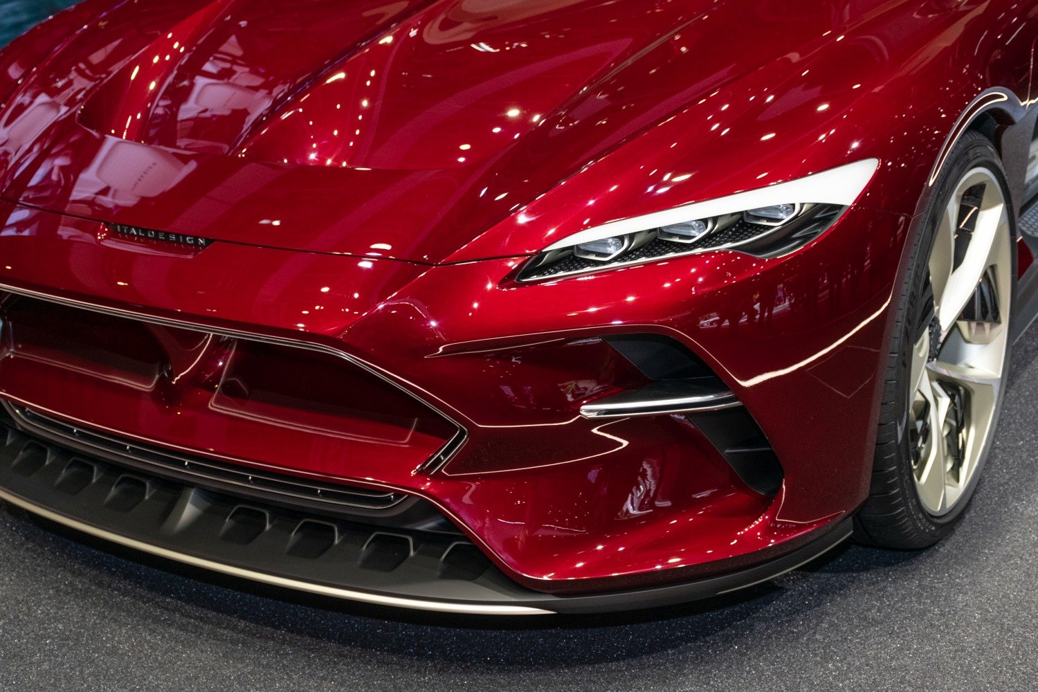 Close-up of sleek front bumper and multi-element headlights.