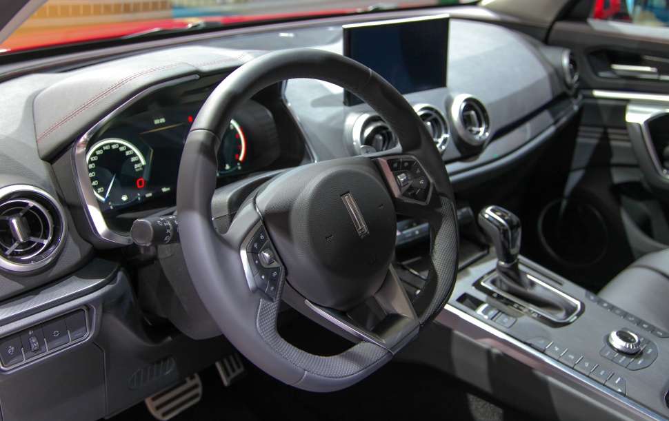 Modern dashboard with digital speedometer and multifunction steering wheel