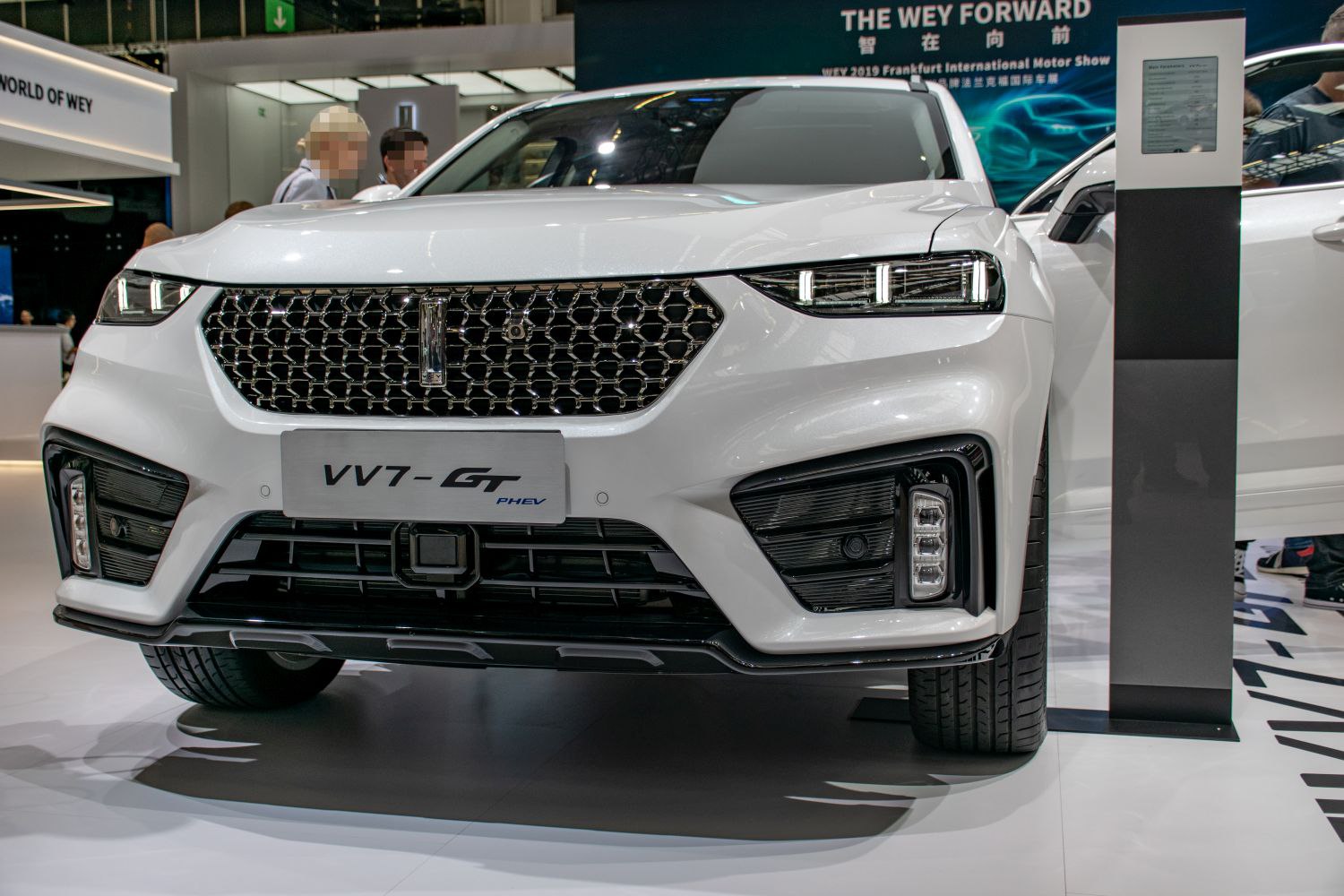 Front grille and aggressive LED headlights in close-up.