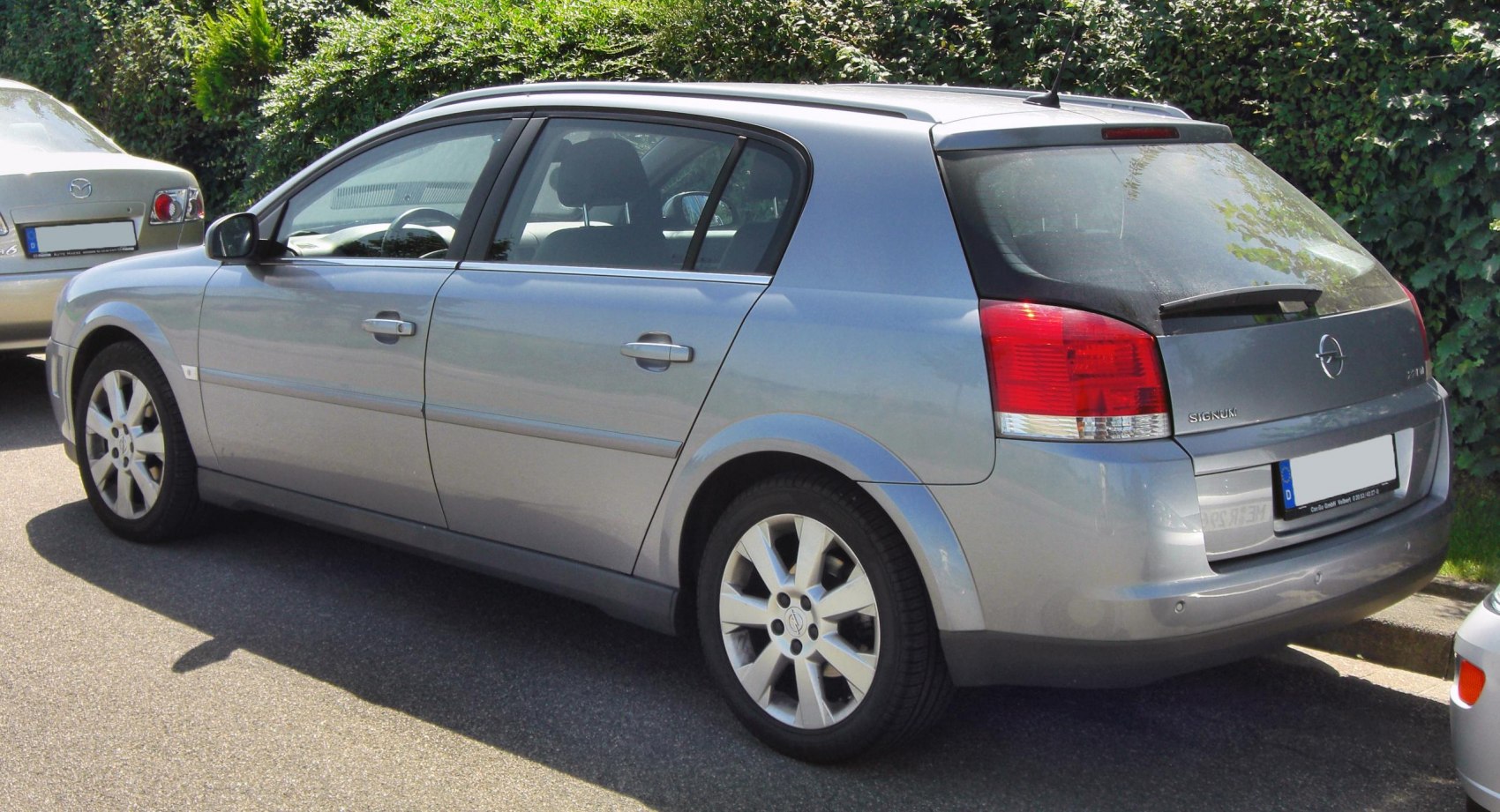 Rear and side profile of silver hatchback with large tail lights