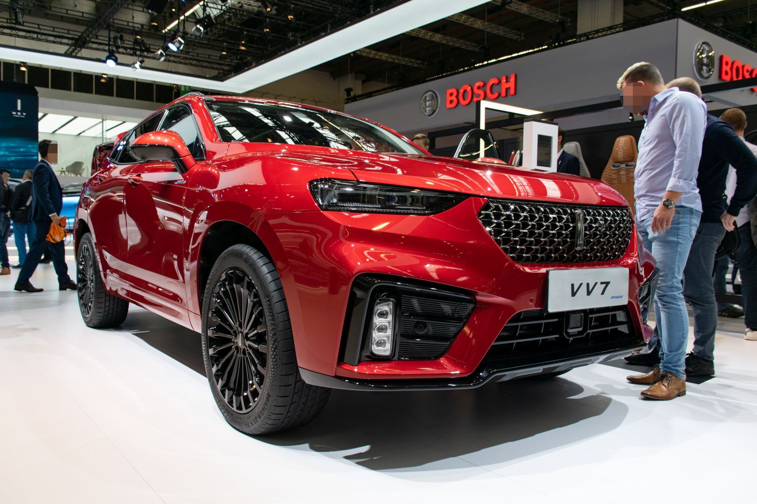 SUV front view with sporty grille, LED headlights, and black alloy wheels