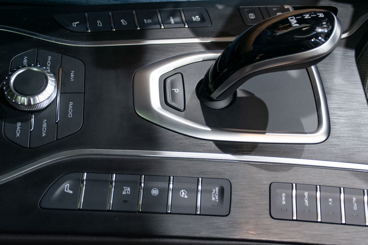 Close-up of modern gear shift lever and multifunction control buttons