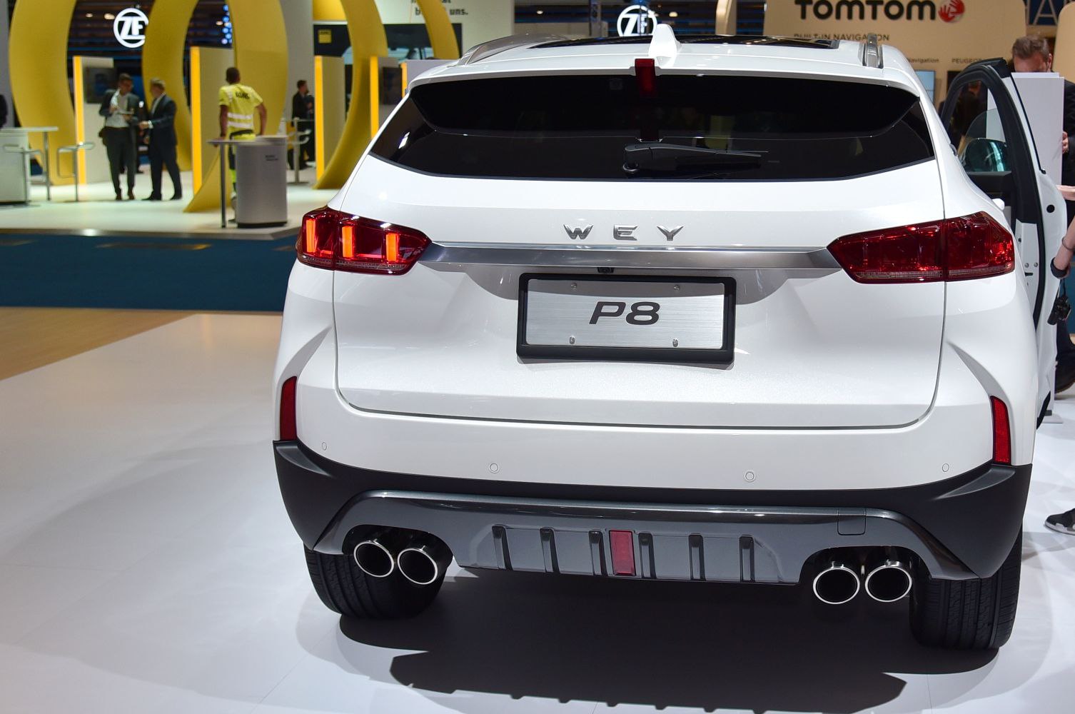 Rear view with tail lights and quad exhaust pipes