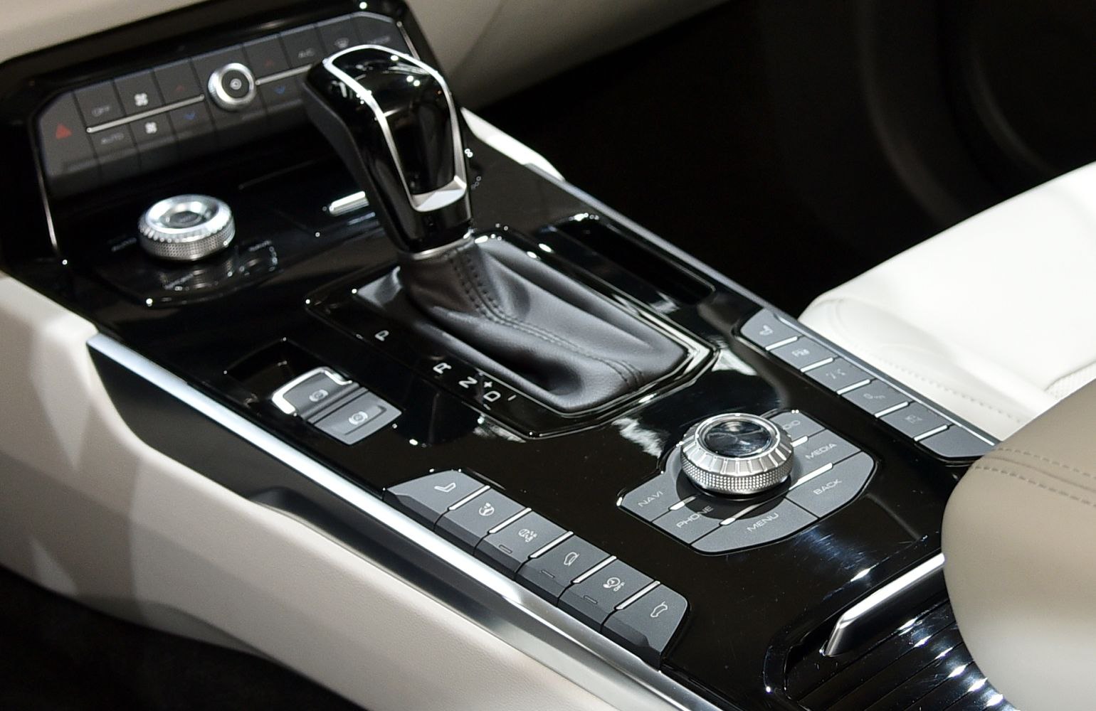 Gear shifter and center panel with multiple control buttons