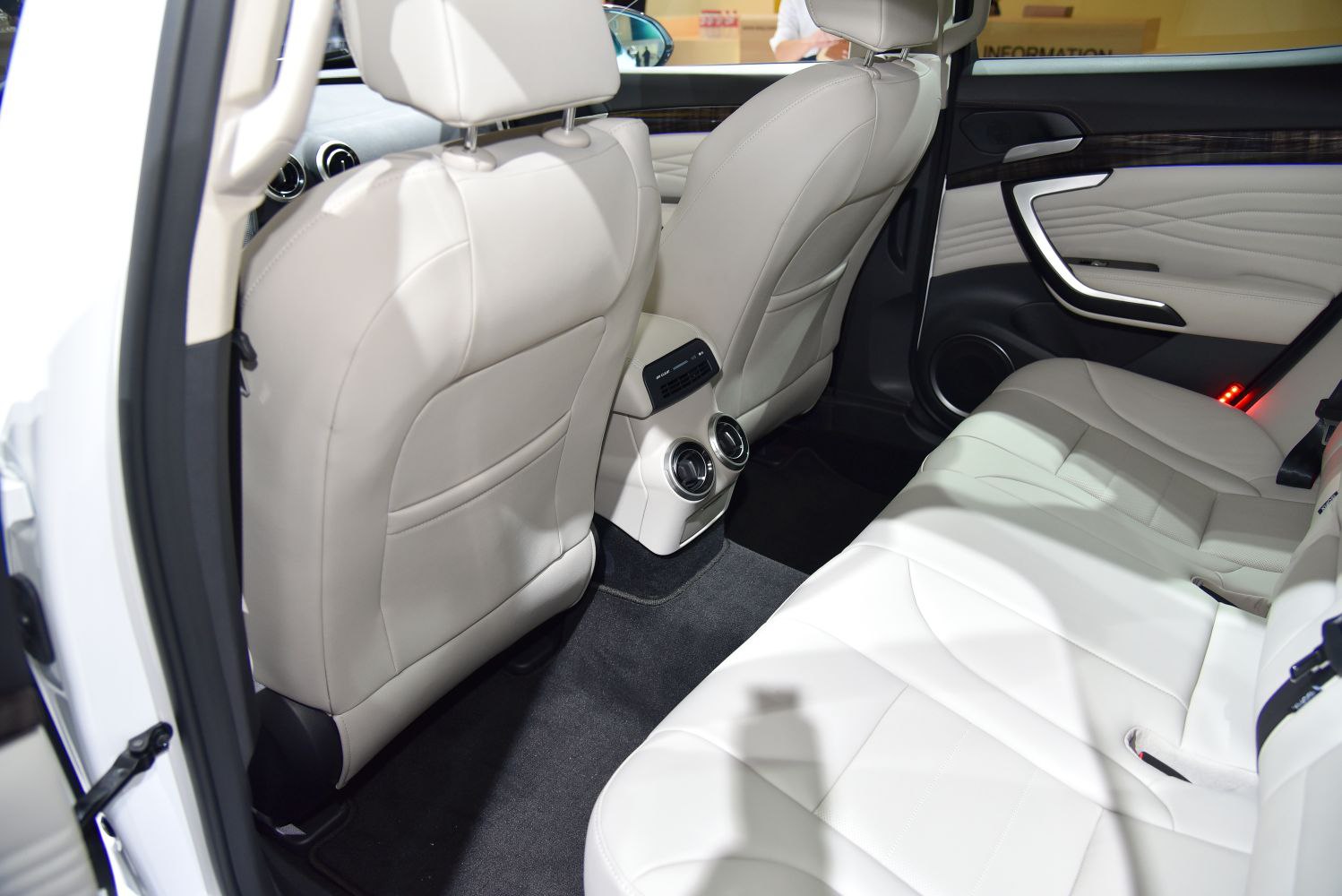 Luxurious rear seats with leather upholstery and rear air conditioning vents.