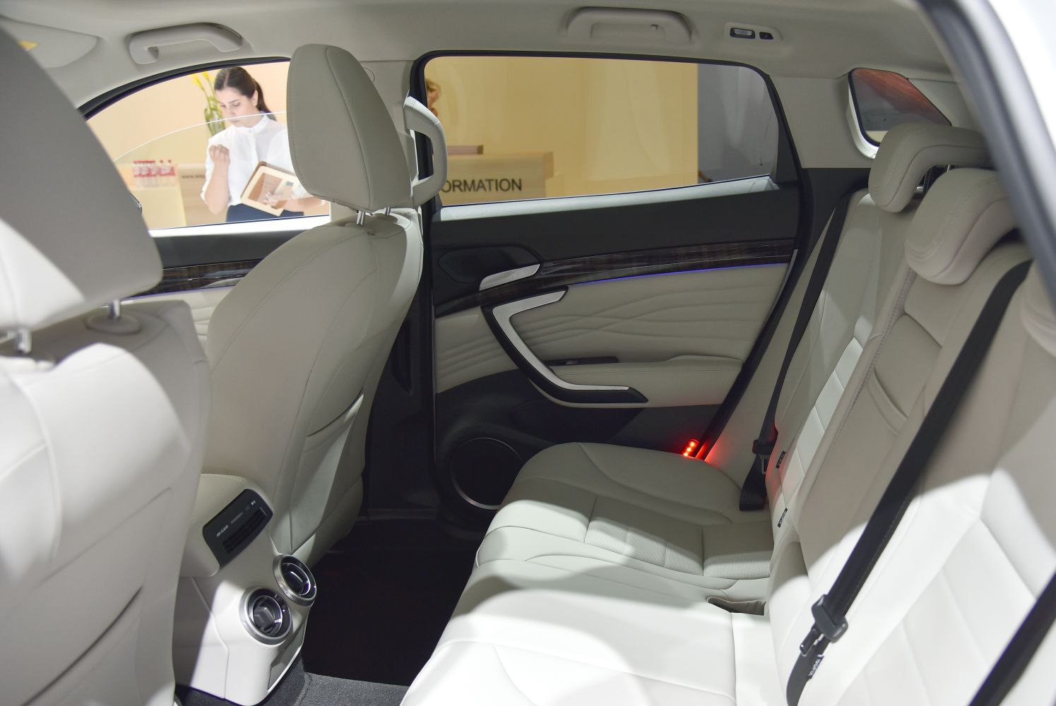 Beige leather rear seats with ambient lighting and rear air vents