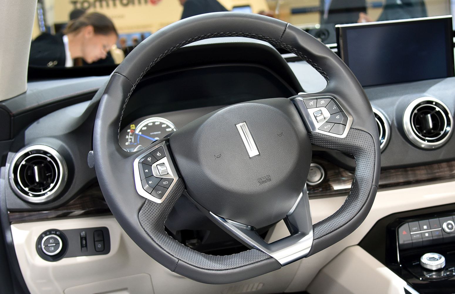 Modern steering wheel with integrated control buttons and digital dashboard