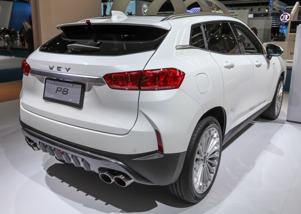Rear view of SUV with quad exhaust and sleek taillights