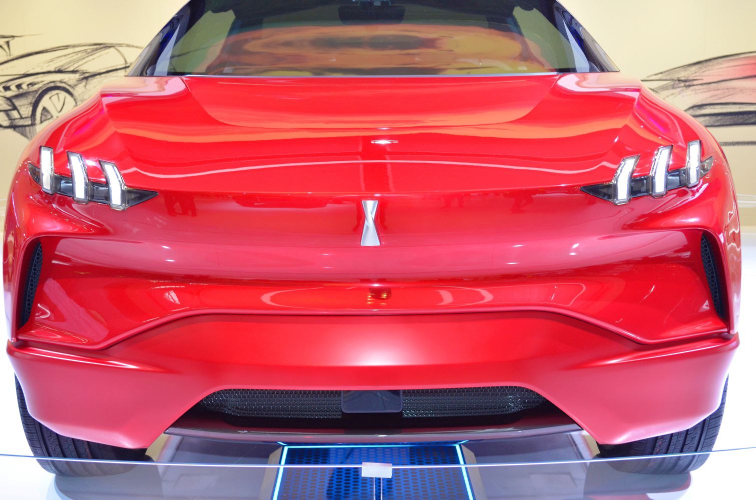 Bold red front with triple vertical LED headlights