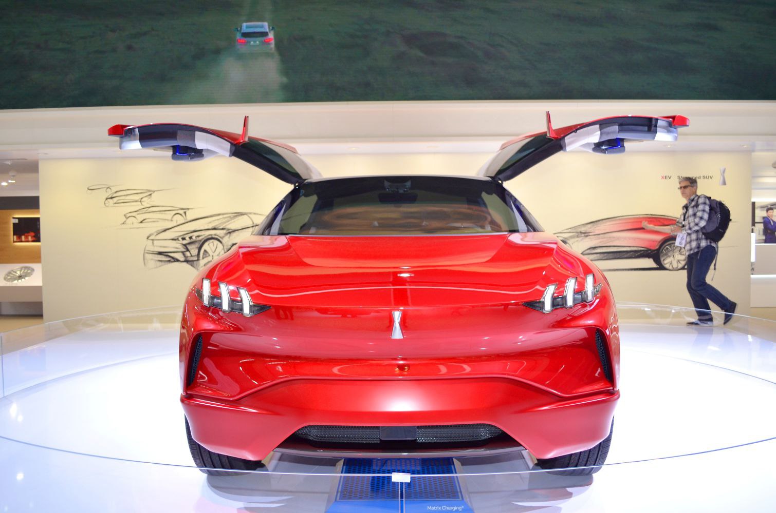Red futuristic SUV with striking gullwing doors