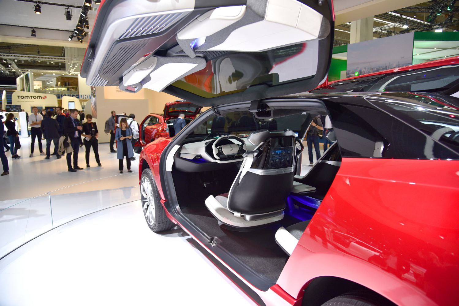 Futuristic car interior with falcon wing door open.
