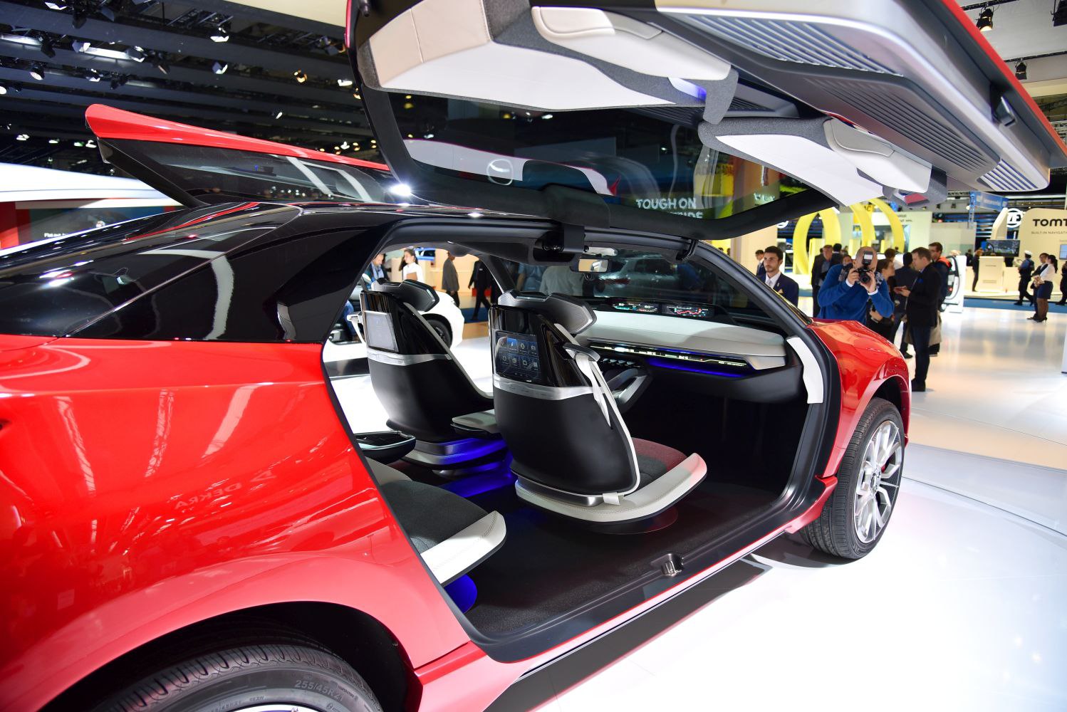 Futuristic car interior with swivel seats and digital displays