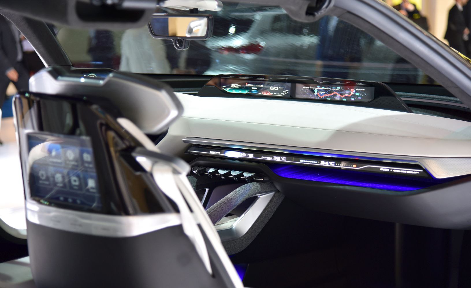 Digital dashboard with futuristic interface and ambient lighting inside concept car