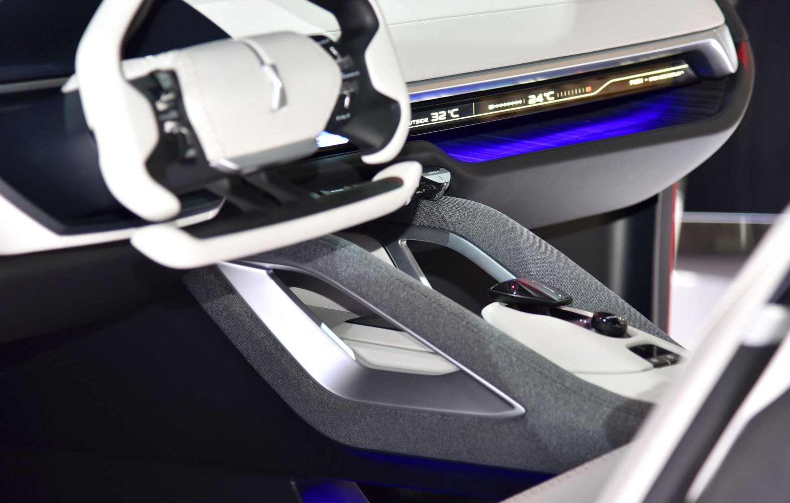 Futuristic dashboard with digital display and unique steering wheel design