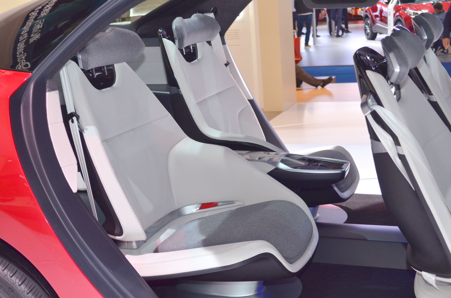 Futuristic innovative car seats with integrated headrests and central console