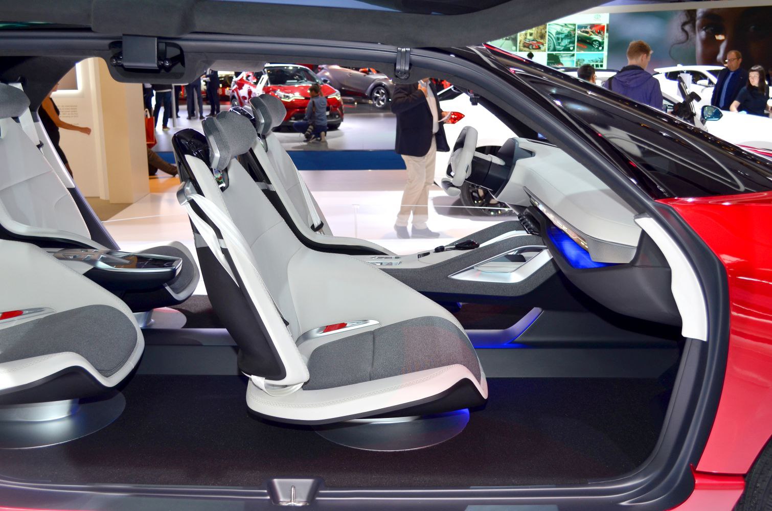 Futuristic interior with swivel seats and digital dashboard lighting