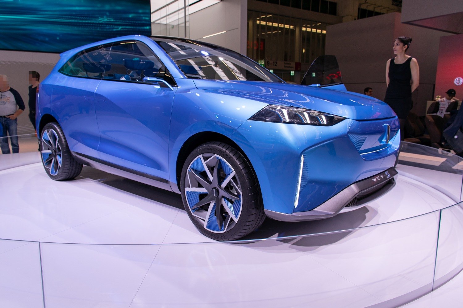 Futuristic blue SUV with LED headlights and aerodynamic wheels