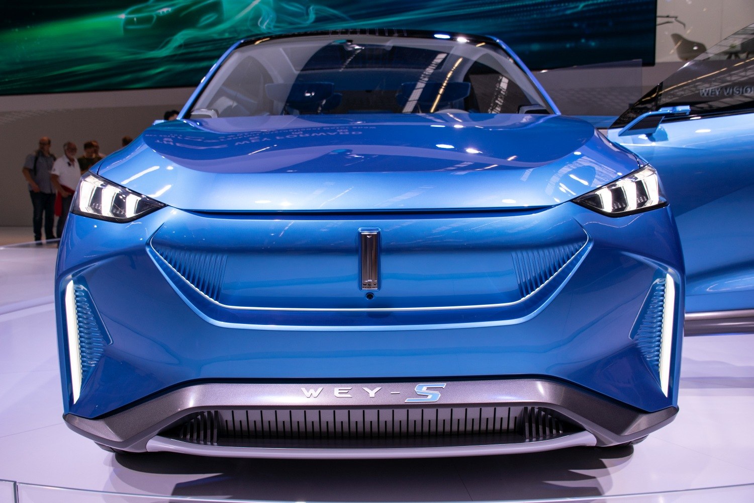 Futuristic front design with LED headlights and smooth aerodynamic grille