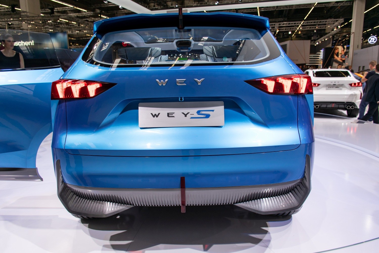 Rear view with distinctive angular tail lights and blue metallic finish