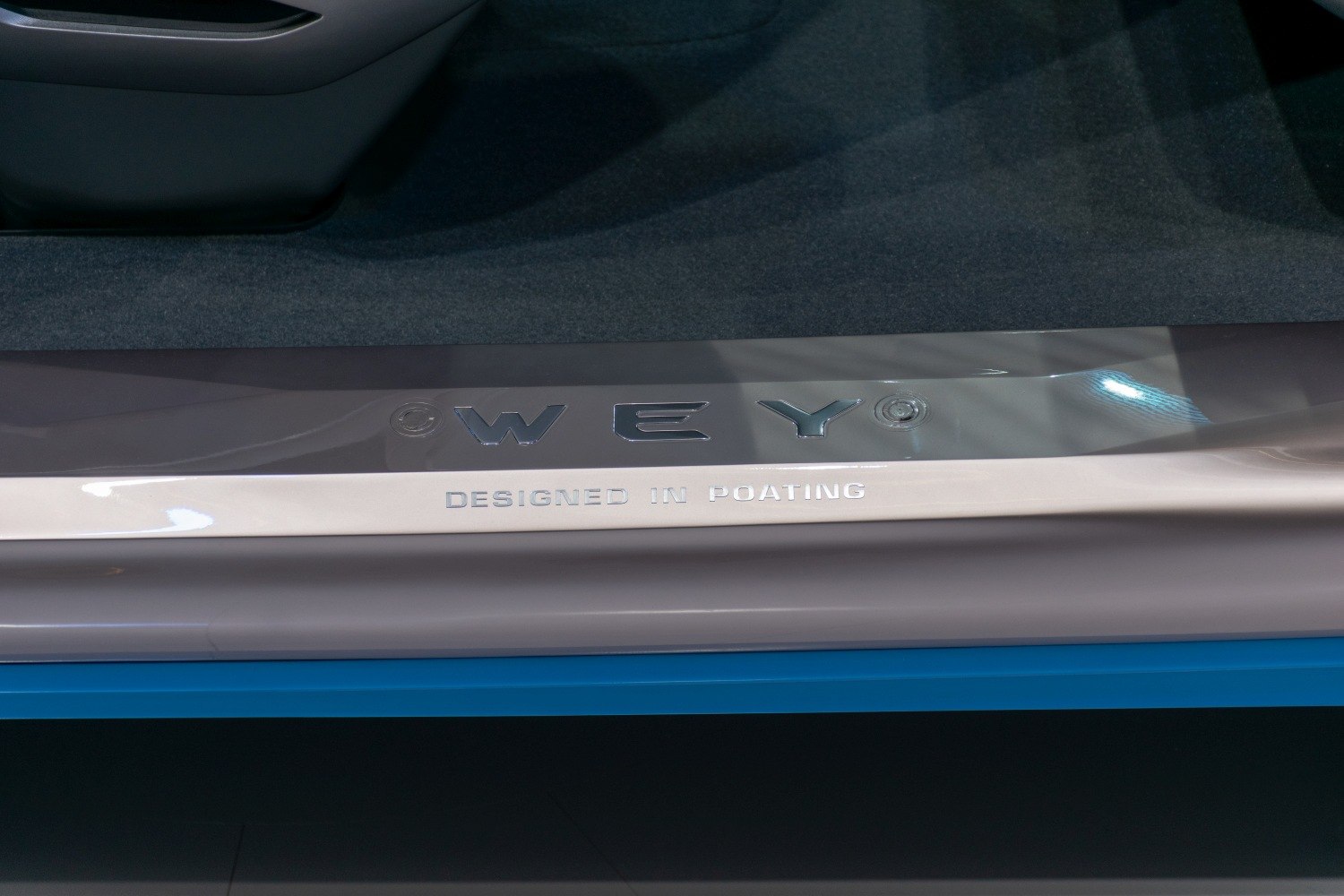 Car door sill trim with WEY branding and design inscription