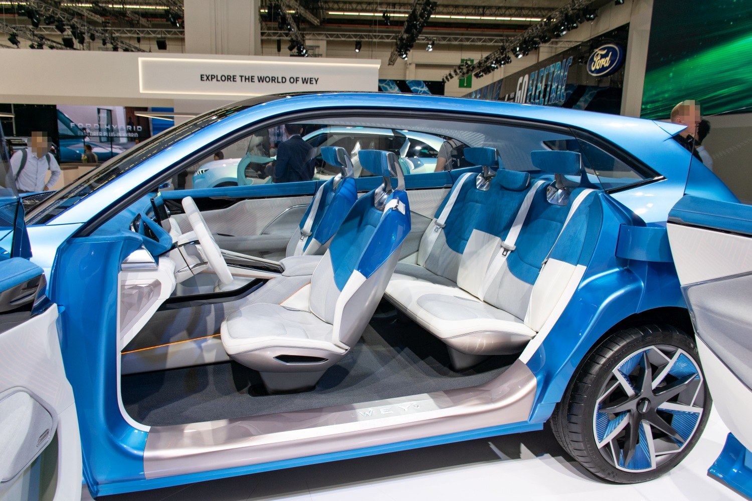 Futuristic interior with unique door design and blue-white seats