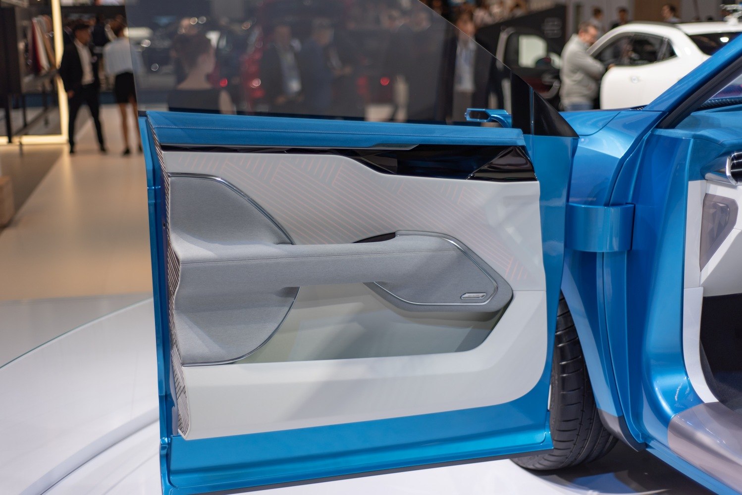 Modern stylish car door interior panel with sleek lines and premium materials.