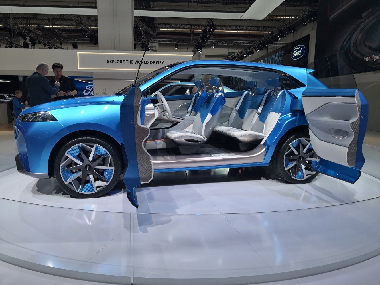 Futuristic SUV with front and rear-hinged doors and modern interior seats