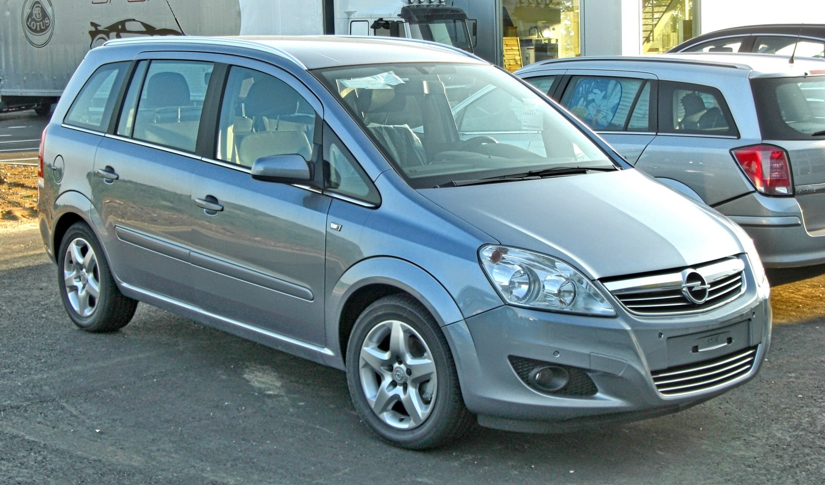 Front side view of silver multi-purpose vehicle with aerodynamic design and alloy wheels