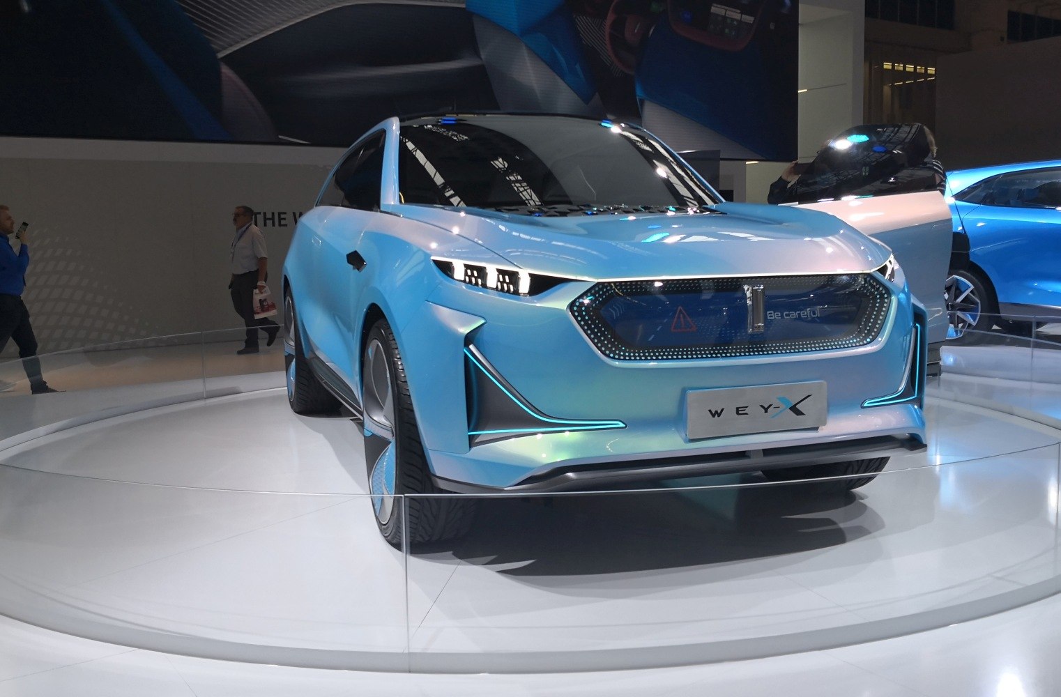 Futuristic front design with unique LED headlights and illuminated grille