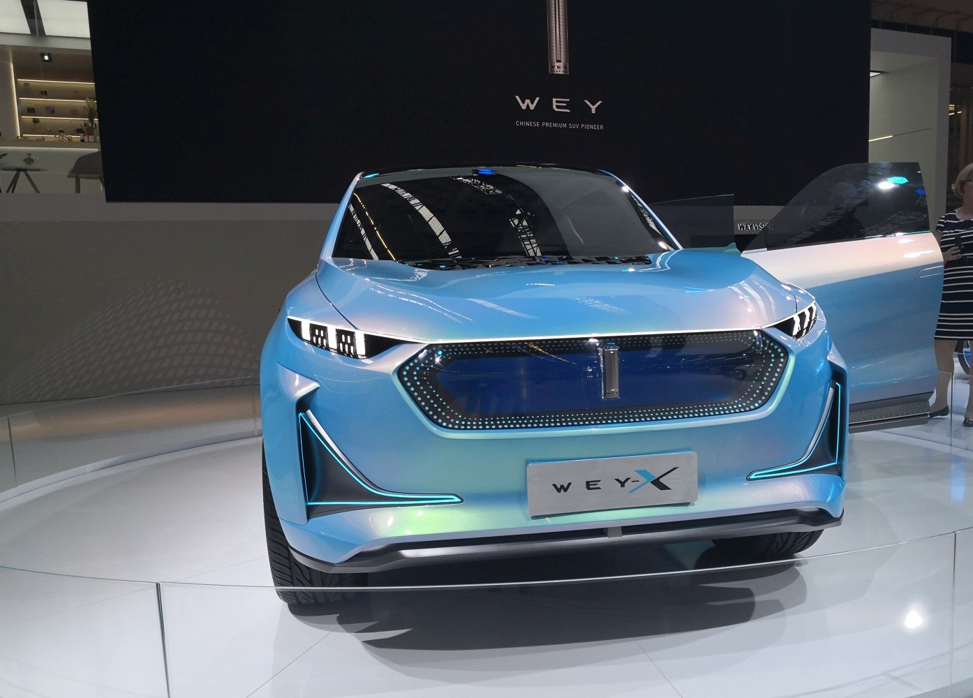 Futuristic front view with LED headlights and illuminated grille