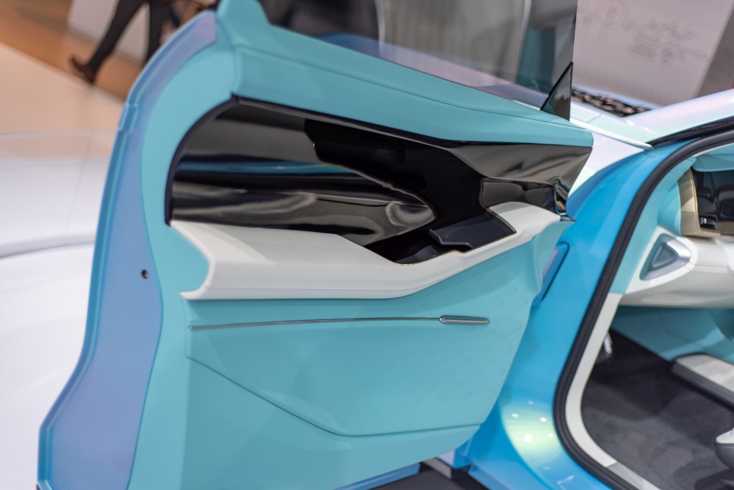 Futuristic car door panel with blue, white, and black colors