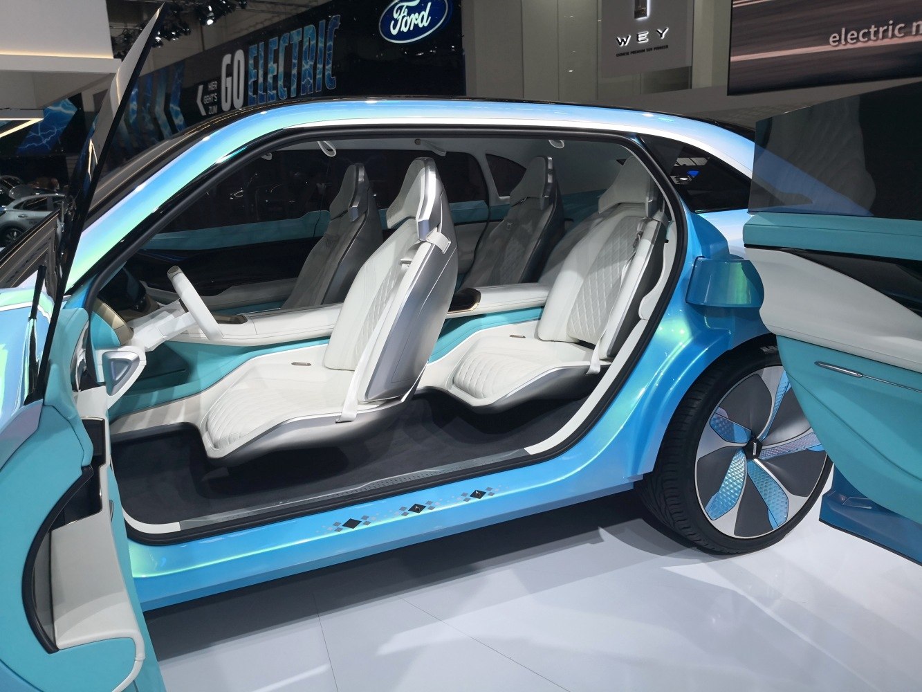 Futuristic floating seats and unique door style with spacious cabin.