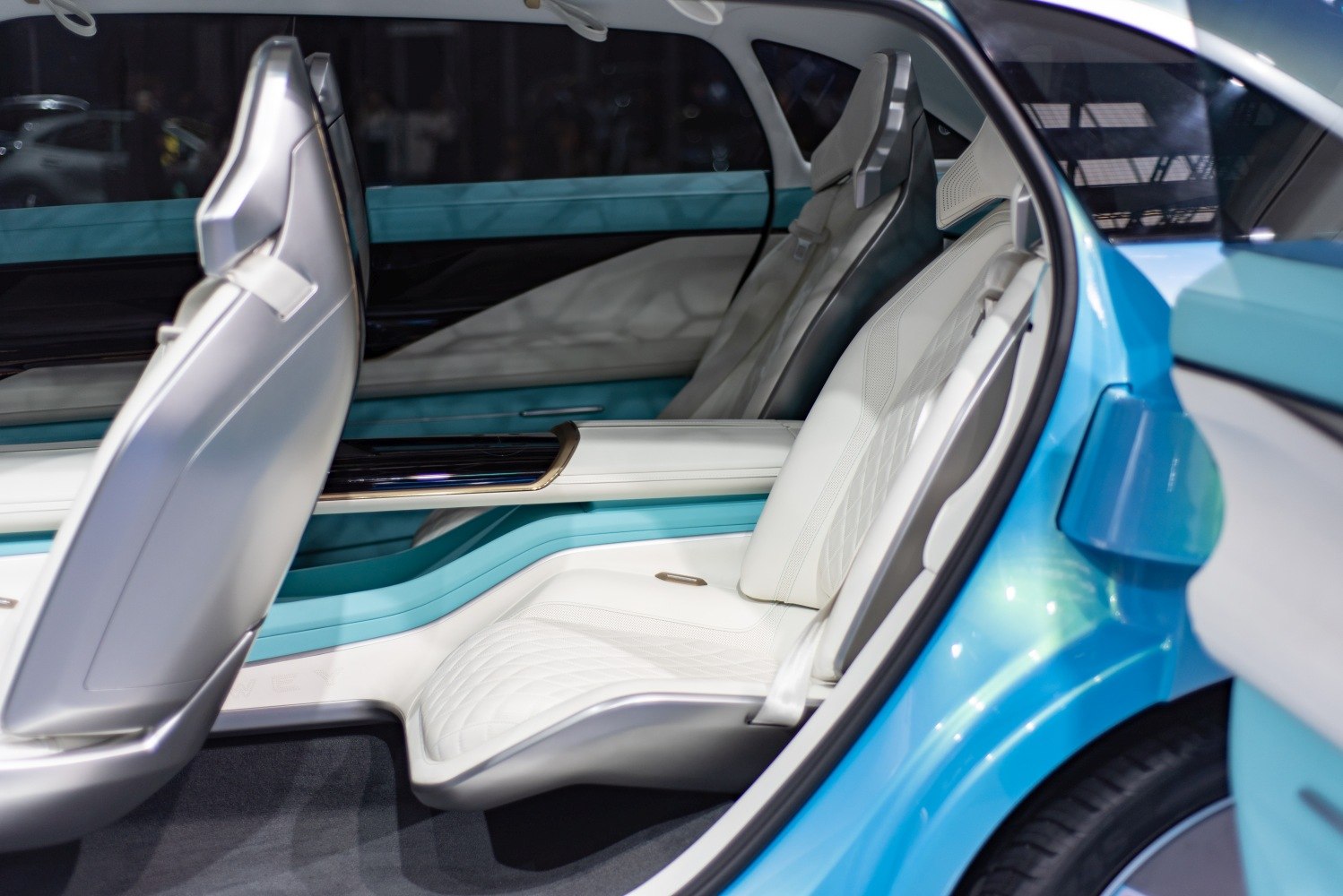 Futuristic white quilted rear seats with modern interior accents