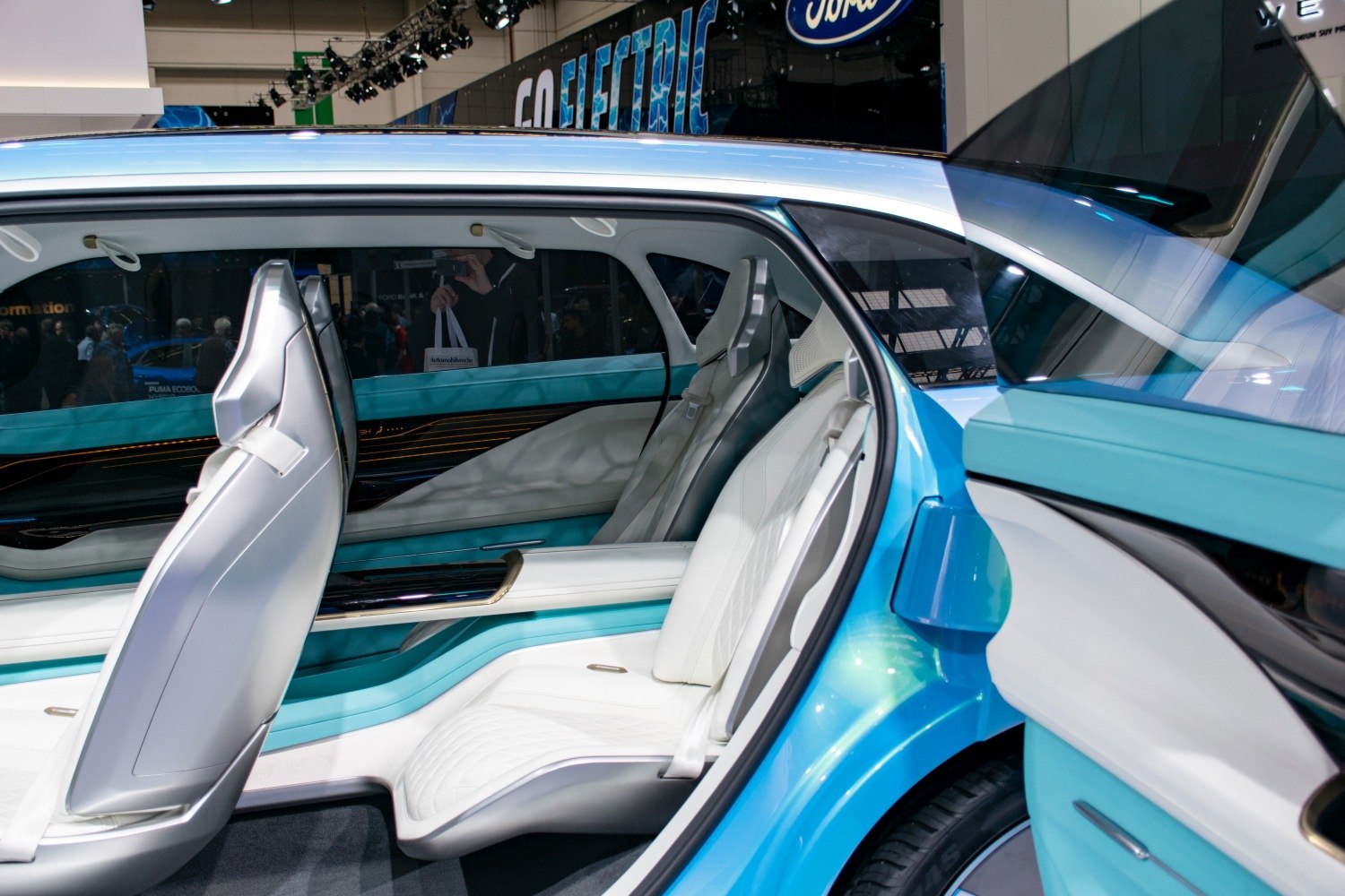 Futuristic white leather rear seats in spacious car interior