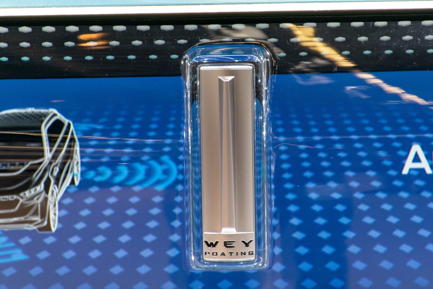 Close-up of modern sleek door handle with clear housing and metallic center