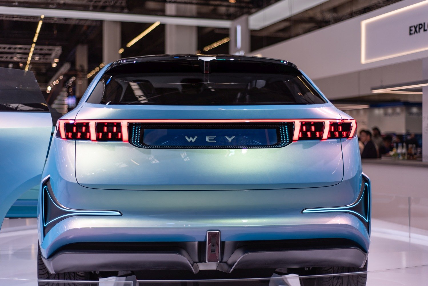 Rear view with futuristic LED tail lights and aerodynamic design
