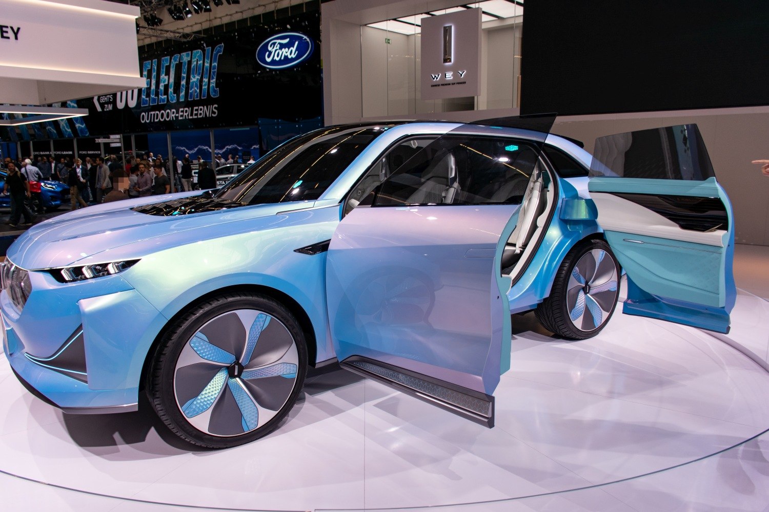 Electric SUV with rear-hinged doors and aerodynamic wheels