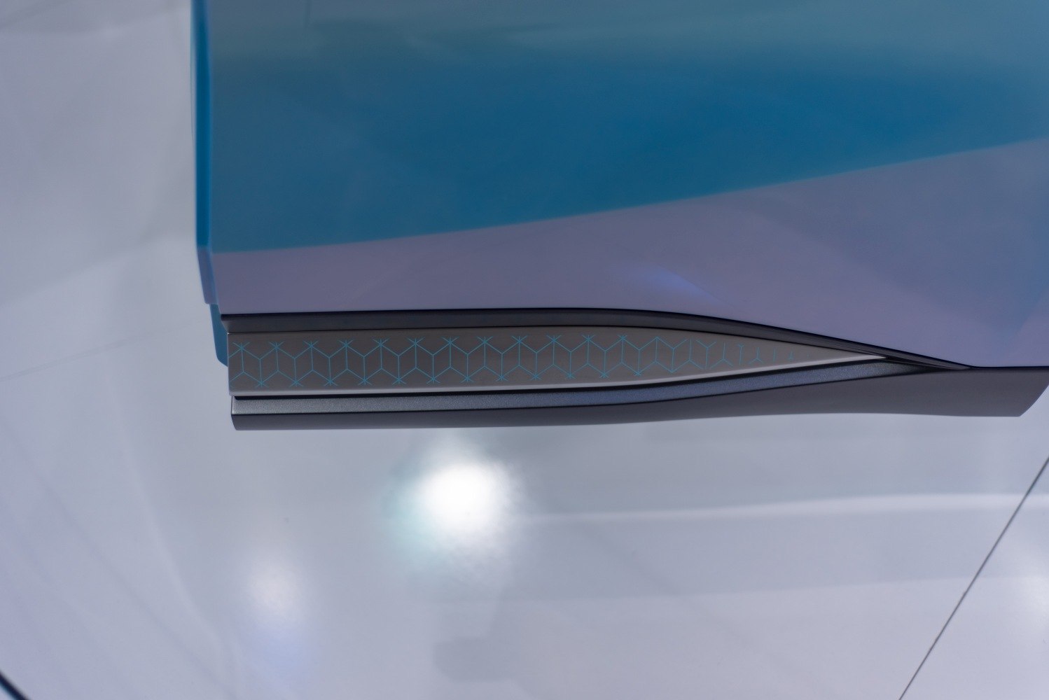 Electric car door panel with geometric pattern and sleek trim