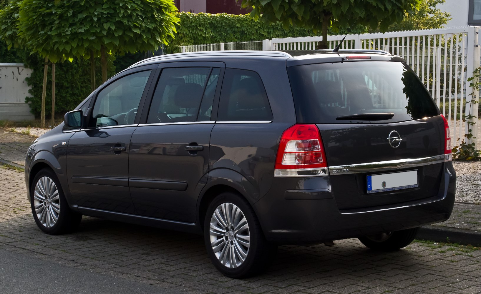 Rear side view of MPV with distinct tail lights and alloy wheels