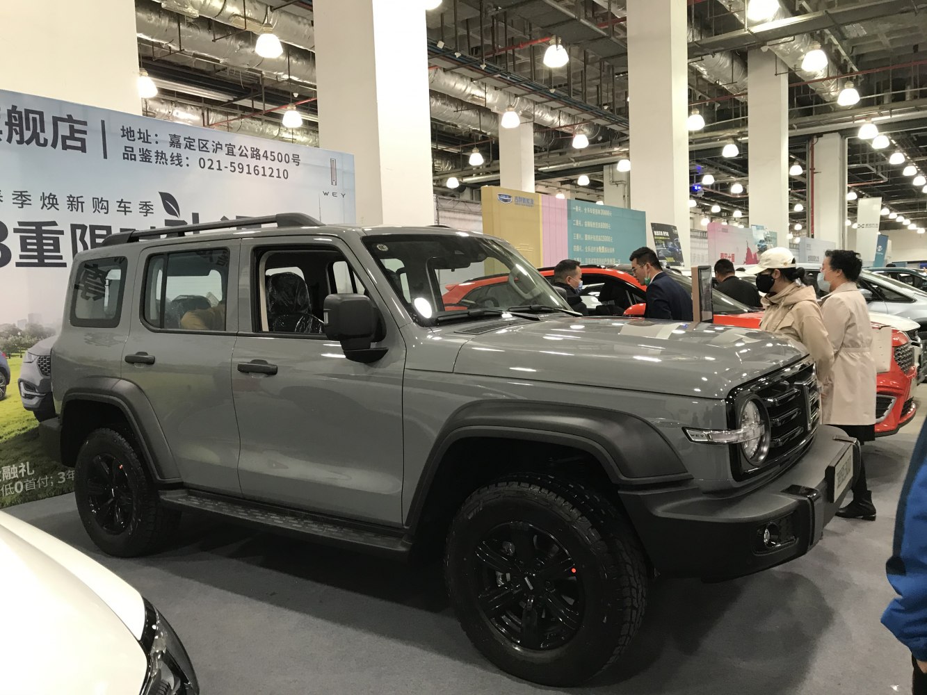 Rugged SUV with round headlights and black wheels