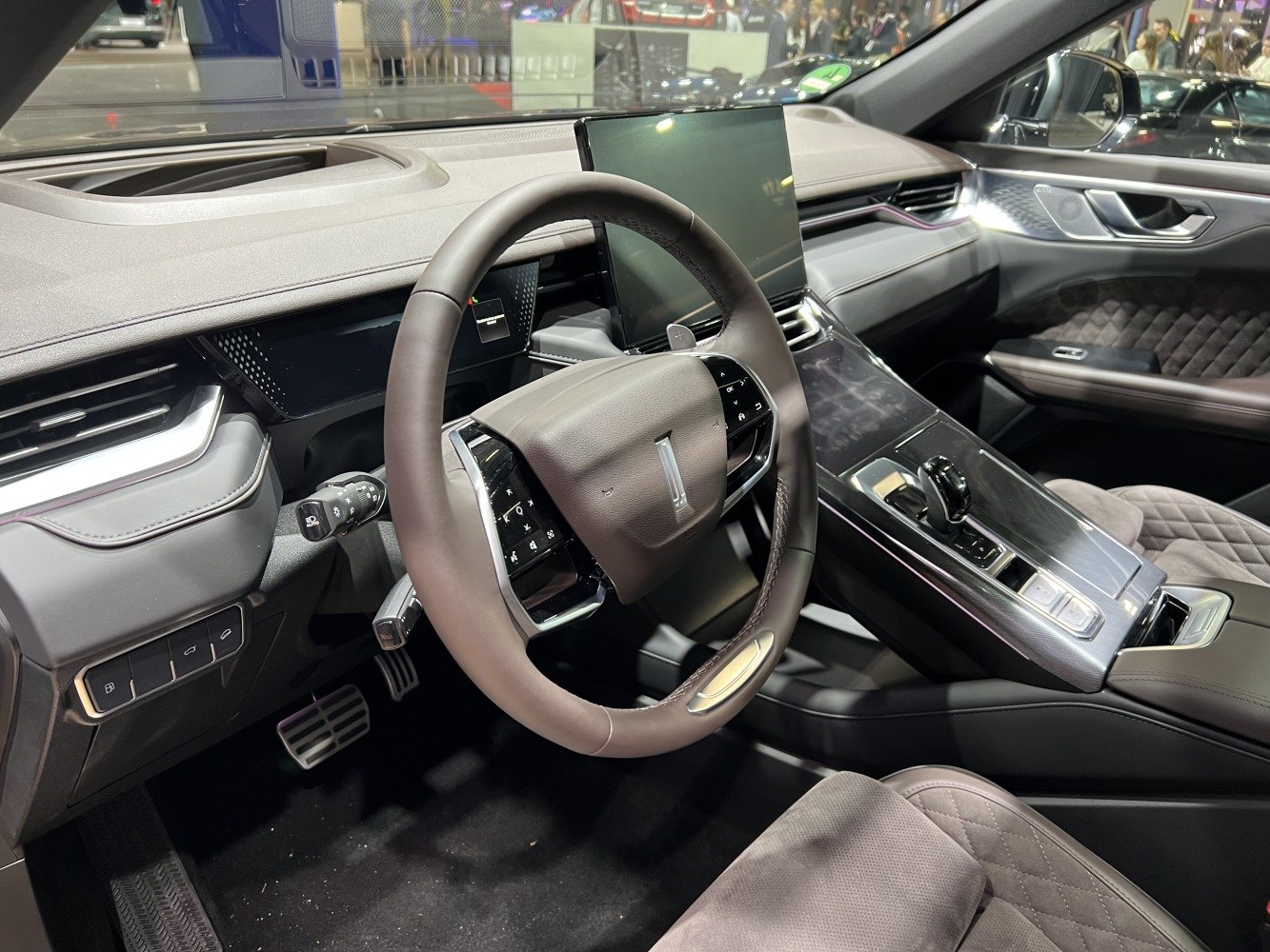 Modern steering wheel and digital dashboard layout with center console