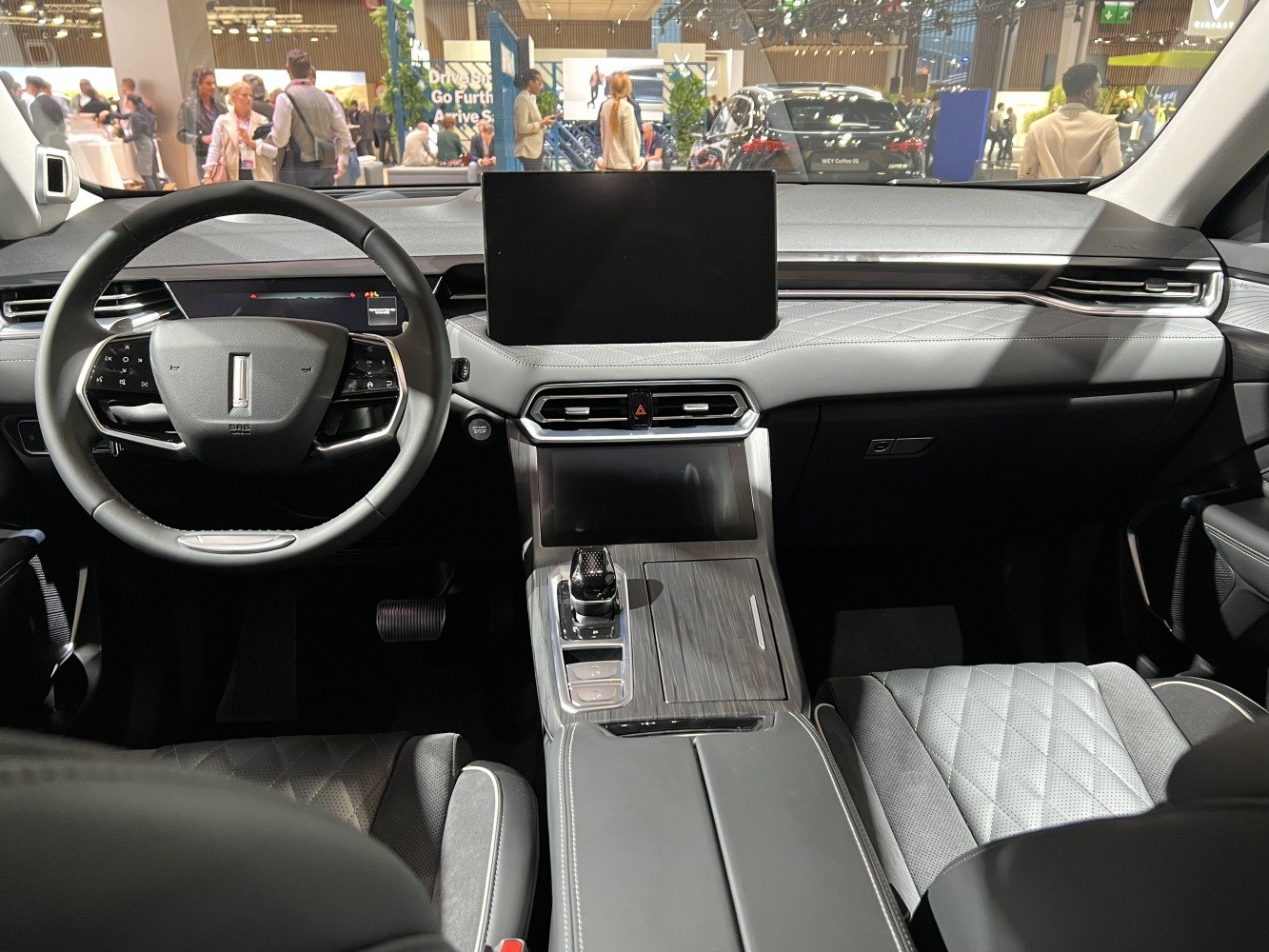 Modern digital dashboard with touchscreen and quilted leather seats
