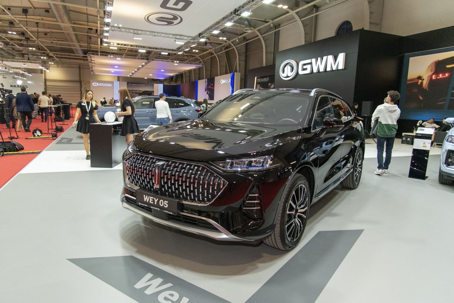 Prominent front grille with sharp LED headlights on a modern SUV.