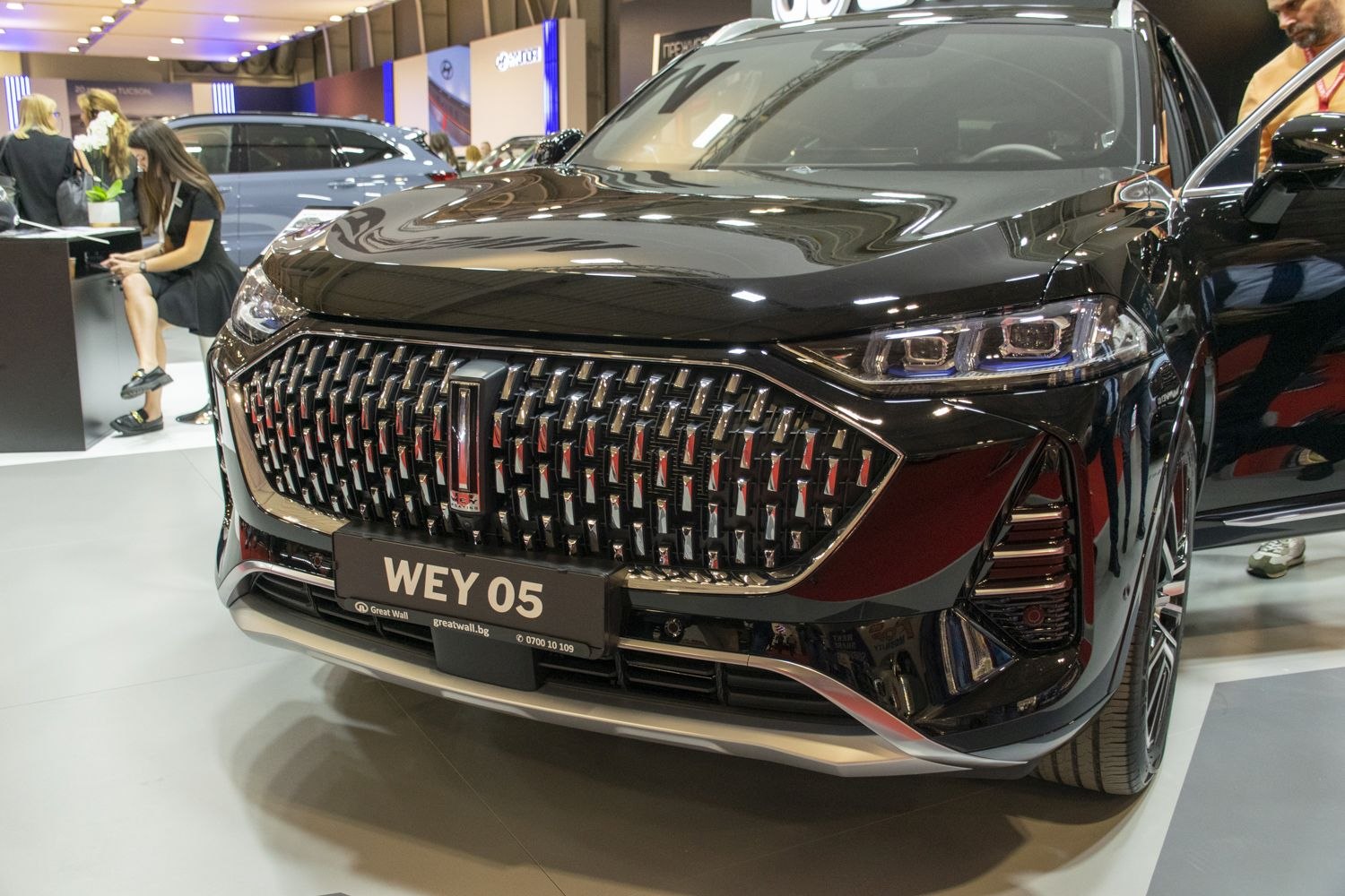 Close-up of a luxury SUV front grille and LED headlights