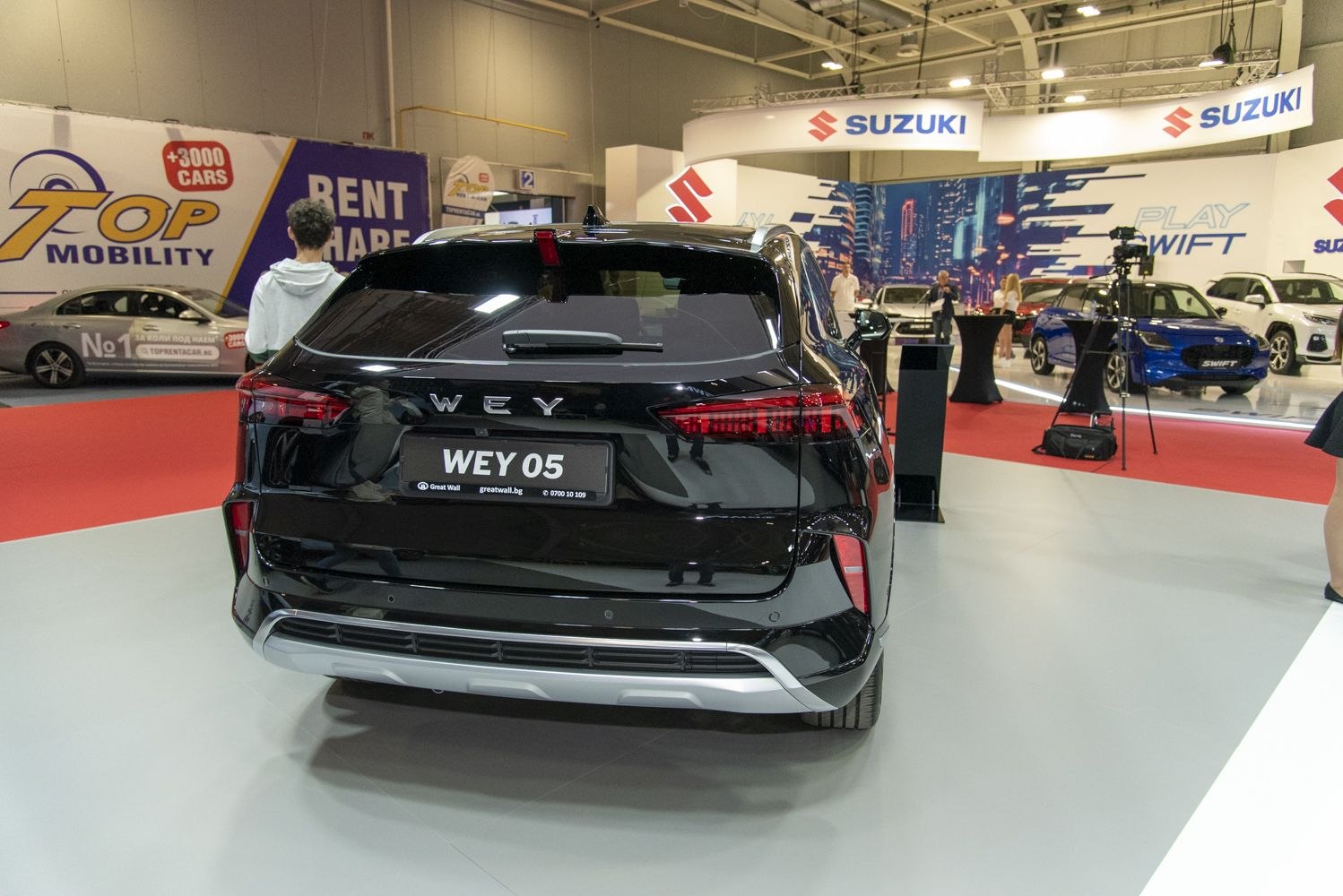 Rear view of modern SUV with sleek taillights and black finish