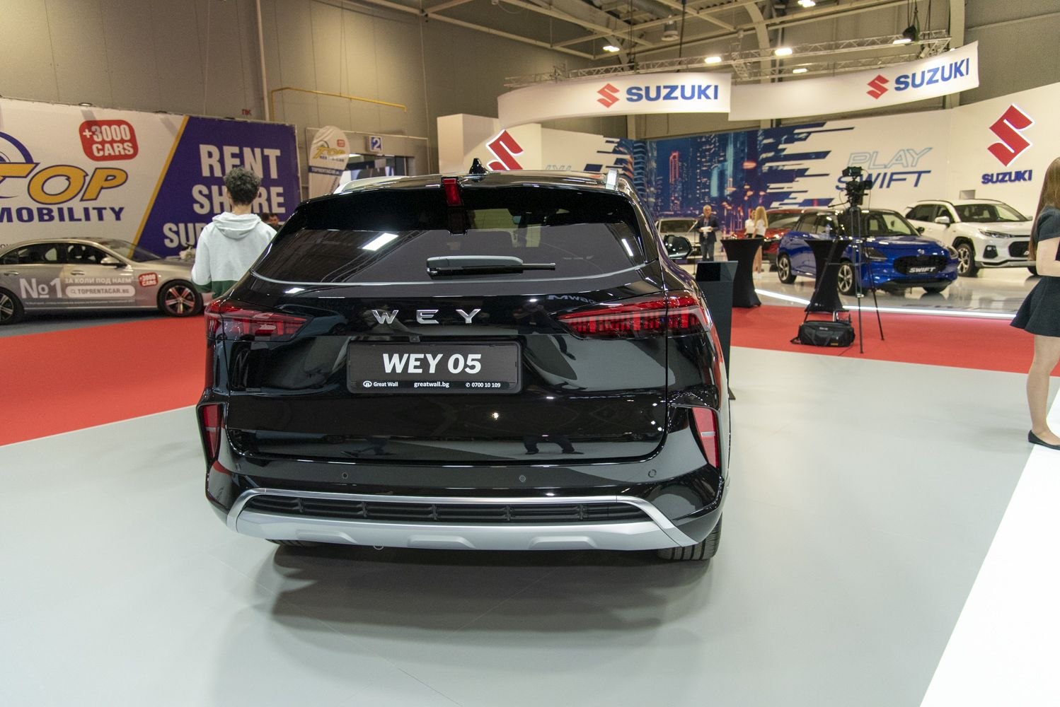 Modern LED taillights and rear bumper of a black SUV