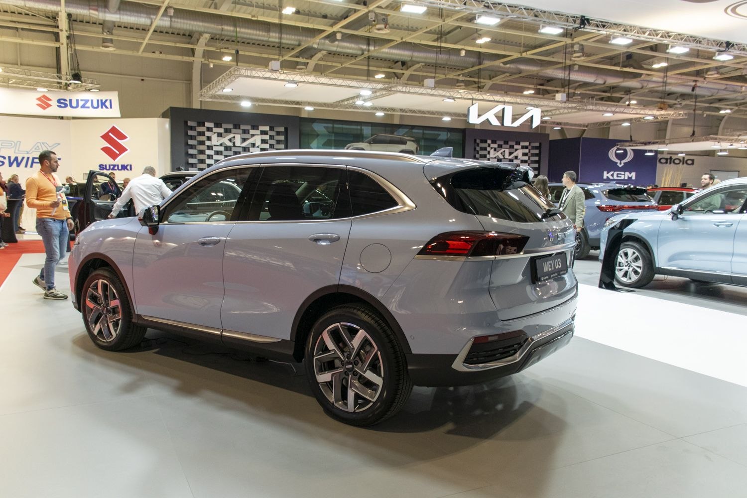 Rear-side view of a modern SUV with sleek body and alloy wheels