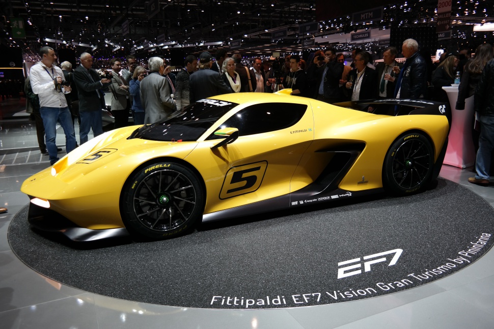 Yellow racing sports car with aerodynamic design and black Pirelli wheels